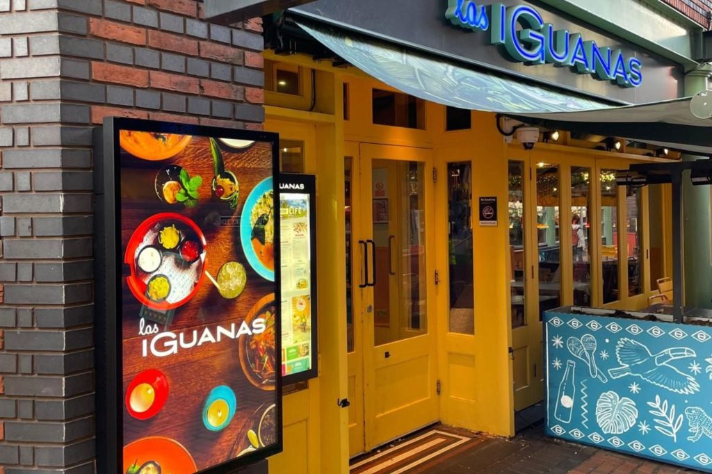 Las Iguanas digital display outside of restaurant